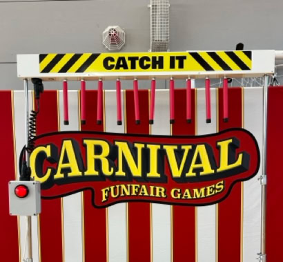 Catch it funfair game testing your reaction times and hand eye coordination 